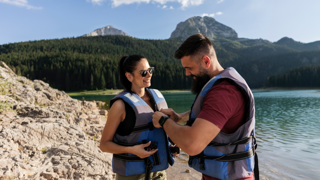 Couple Preparing for Kayak Adventure