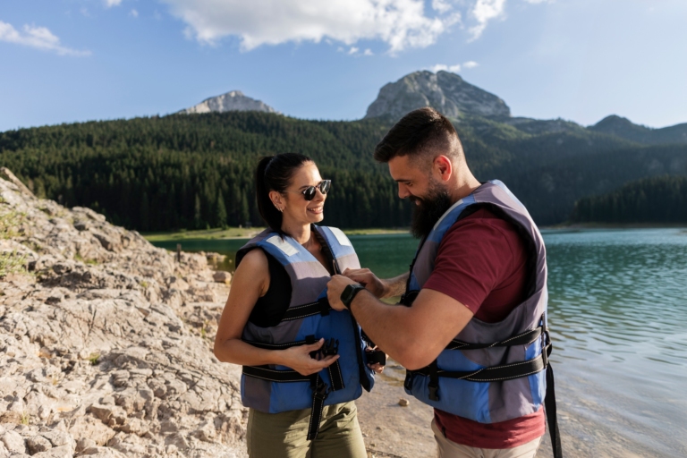 Couple Preparing for Kayak Adventure