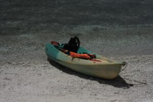Kayak loaded with gear pulled up on the sand